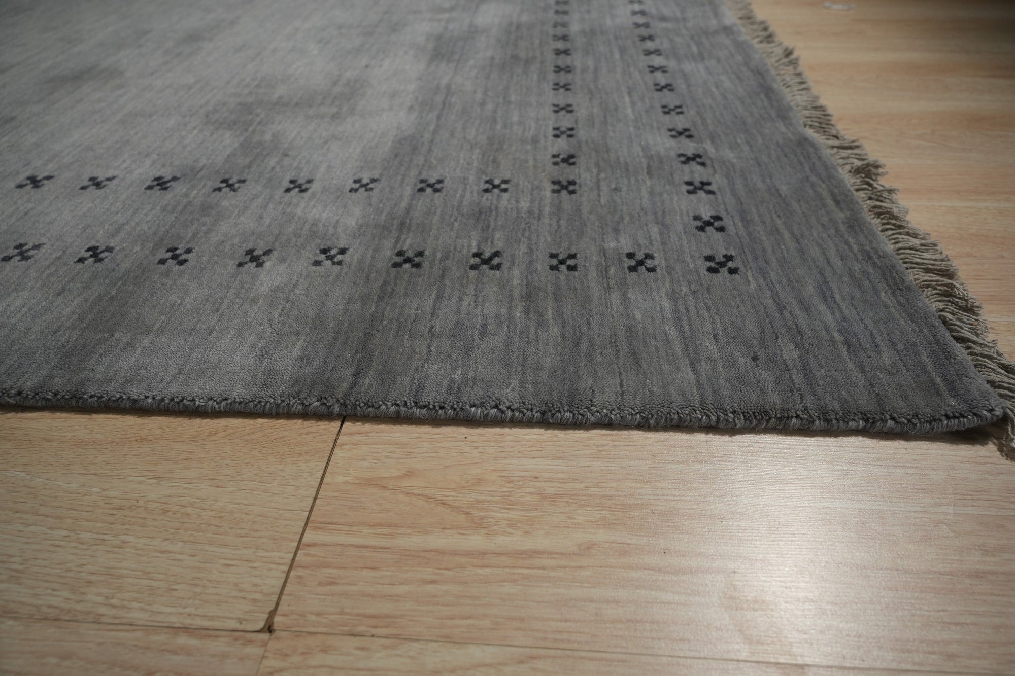 Jasmine Alluring Gray Handmade Wool Rug, softly muted gray hues blend in a subtly textured wool weave, adding warmth and refined elegance to a contemporary living space.