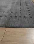 Jasmine Alluring Gray Handmade Wool Rug, softly muted gray hues blend in a subtly textured wool weave, adding warmth and refined elegance to a contemporary living space.