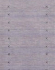 Jasmine Alluring Gray Handmade Wool Rug, with its subtle gray tones and hand-knotted wool construction, anchors a modern living space with textural depth and quiet elegance.