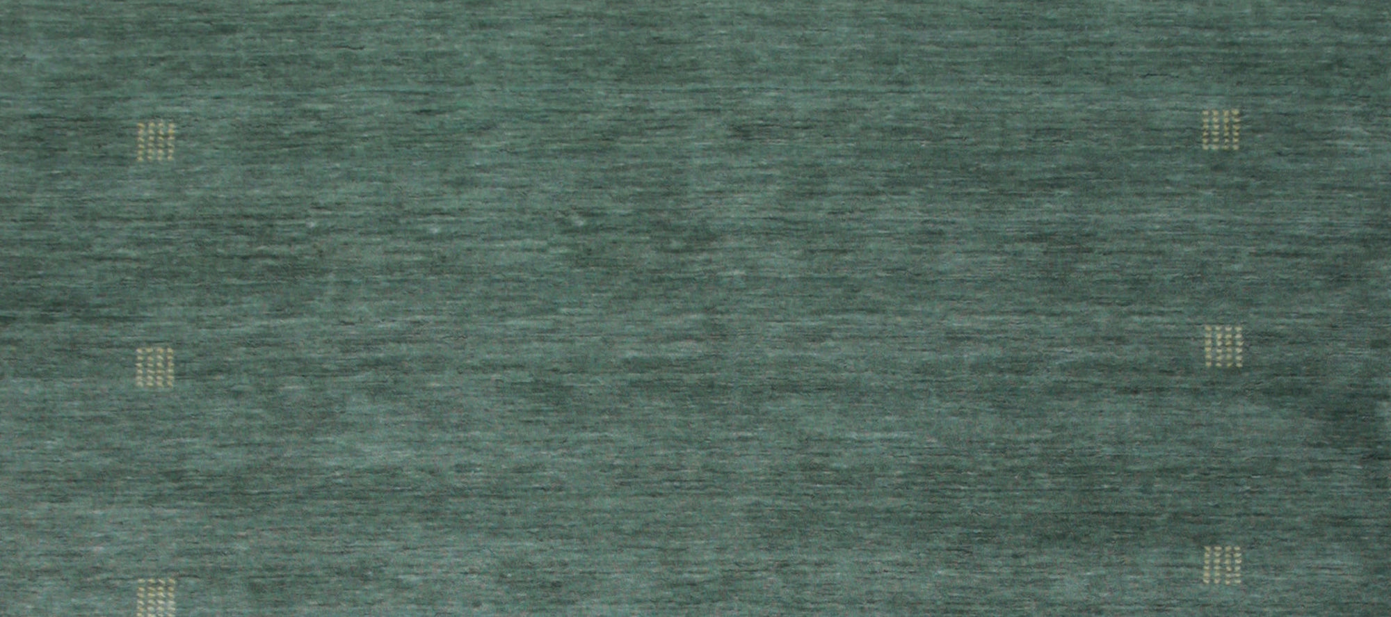 Laine Amara Green Handmade Wool Rug, rich emerald and forest greens swirl in an organic, abstract pattern across this plush wool rug, creating a calming yet sophisticated floor covering.