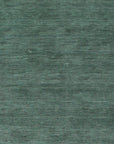 Laine Amara Green Handmade Wool Rug, rich emerald and forest greens swirl in an organic, abstract pattern across this plush wool rug, creating a calming yet sophisticated floor covering.
