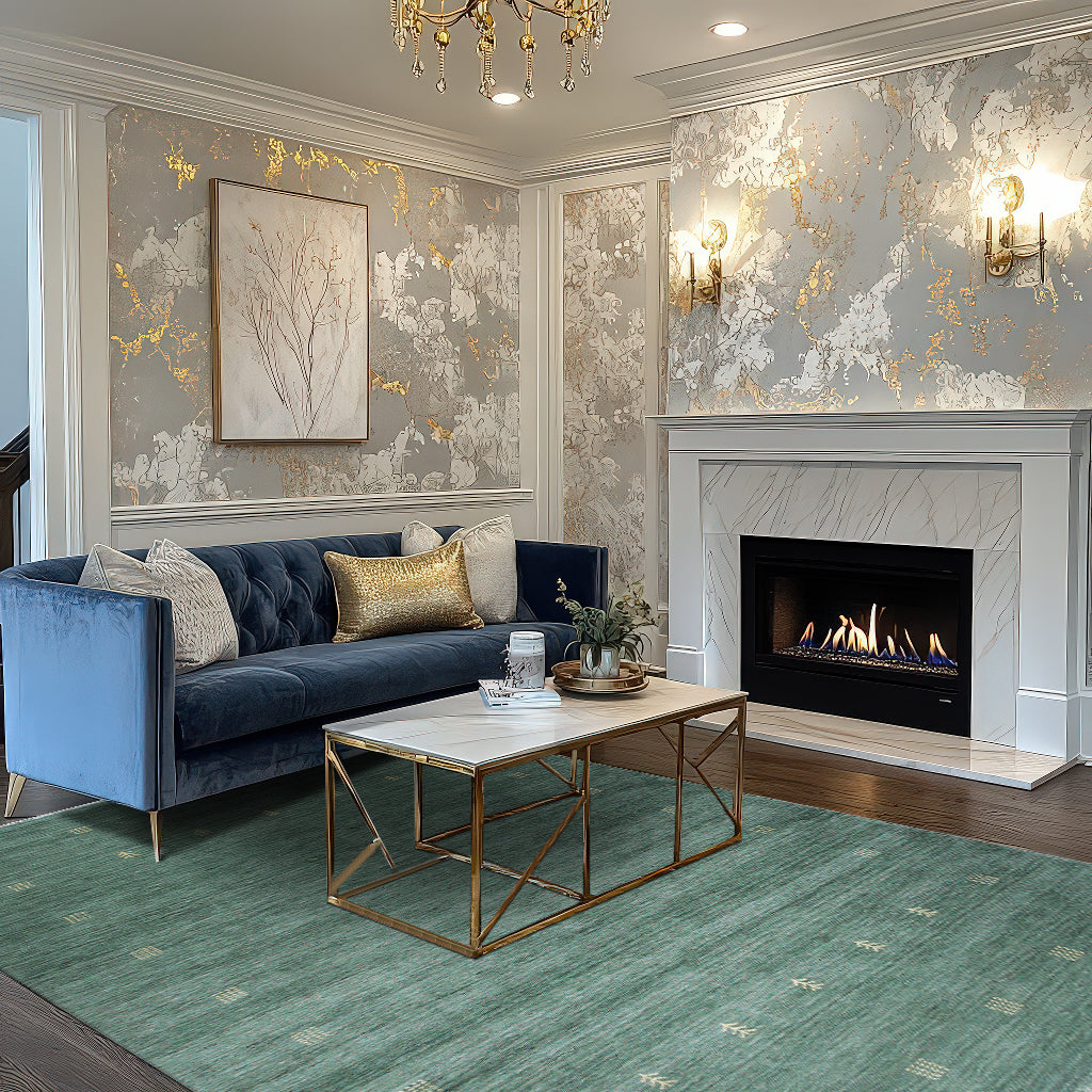 Laine Amara Green Handmade Wool Rug, grounding a warmly lit living space with a vibrant green hue and subtle pattern under a modern side table.