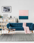 Sophie Alluring Gray Handmade Wool Rug graces a light hardwood floor, its subtle gray tones and hand-woven texture lending understated elegance to the room.