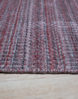 Radiant Elena Red Handmade Wool Rug, vibrant red wool rug with a classic, intricate design, elegantly displayed on a light wood floor, offering a warm and inviting feel.