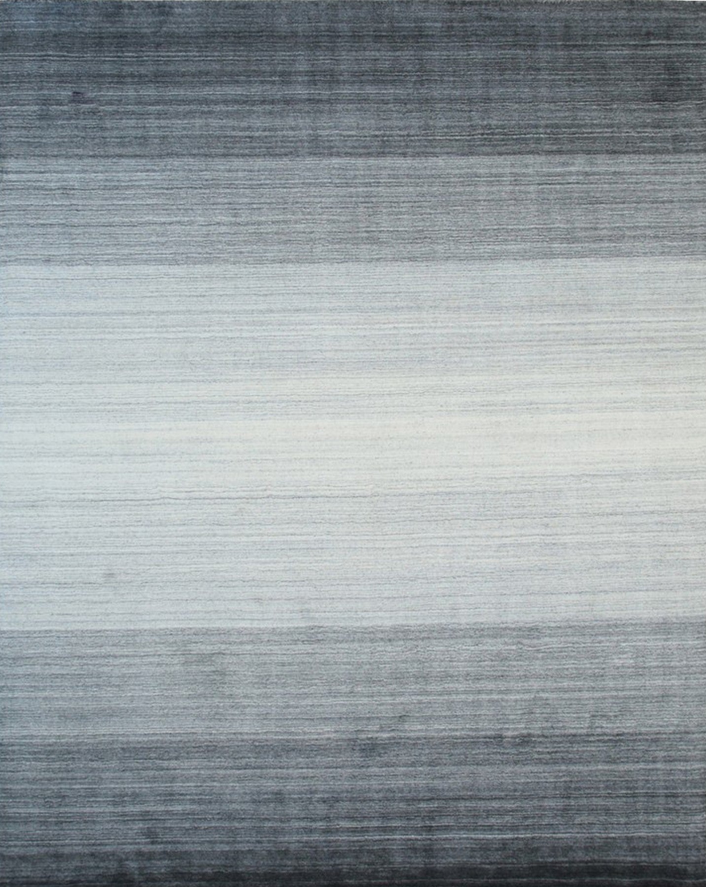 Isolated view of Penelope Nina Charcoal Handmade Wool Rug, showcasing its intricate, textured design and subtle tonal variations in charcoal gray wool.