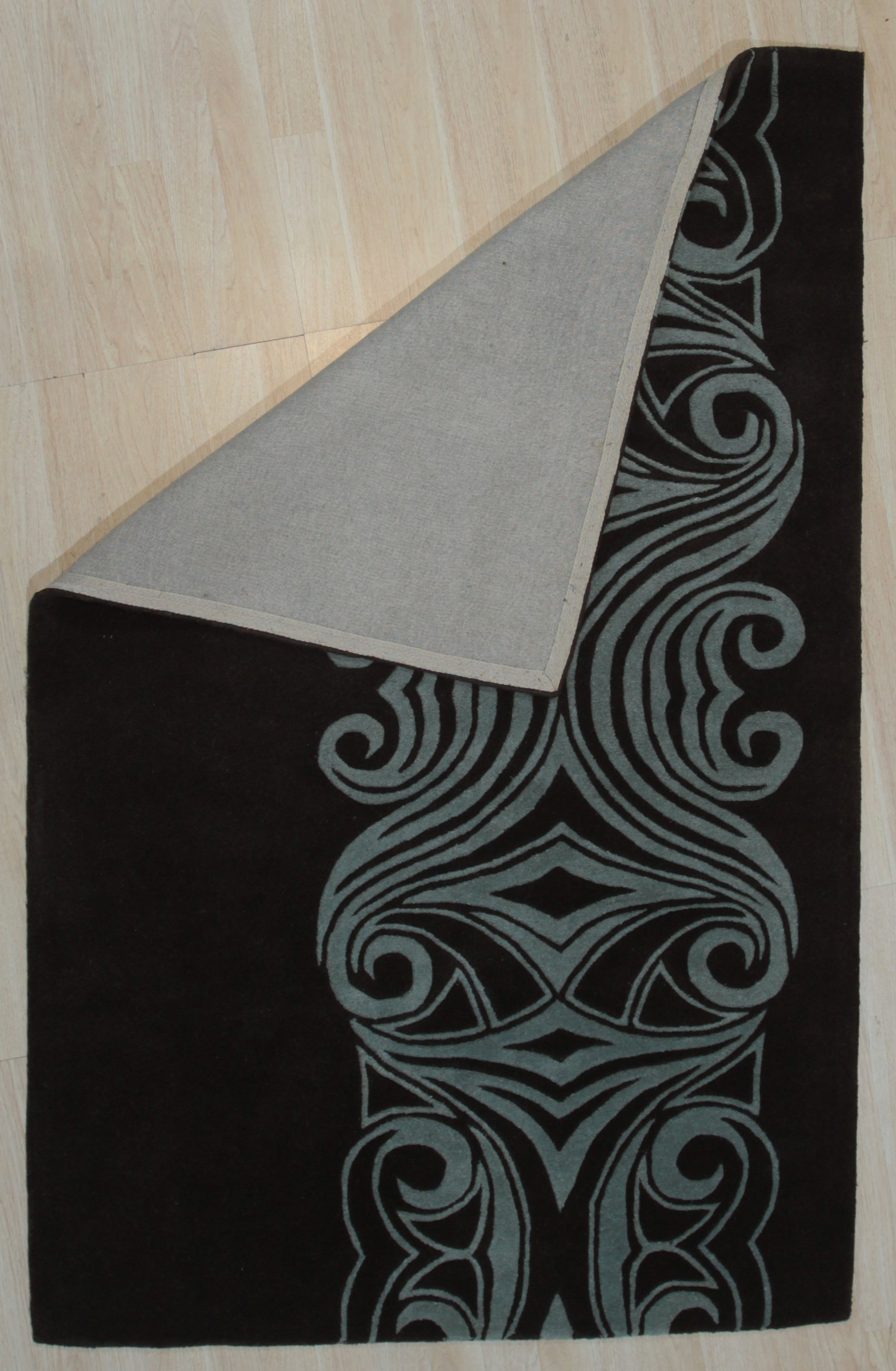 Yara Para Brown Hand Tufted Wool Rug, showcases a warm, earthy palette and plush texture in a contemporary living room setting.