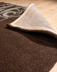 Yara Para Brown Hand Tufted Wool Rug, showcasing textured layers and subtle earth tones in a modern living room setting.