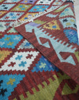 Amara Kilim Multicolor Flatweave Wool Rug, a vibrant explosion of color in a modern living room, showcasing its flatweave wool construction.
