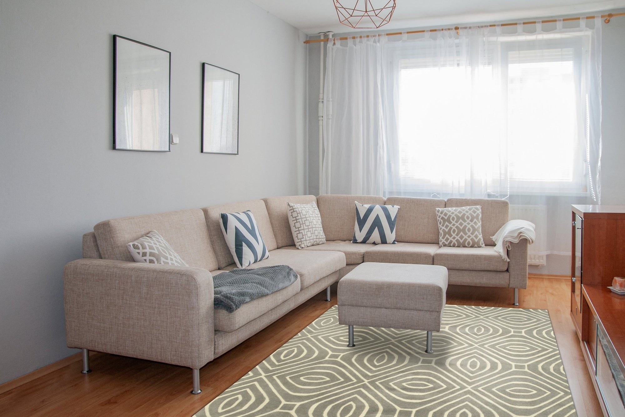 Beautiful Luna Gray Hand Tufted Wool Rug, featuring subtle variations in grey tones, displayed on a light hardwood floor, its dense wool fibers promising warmth and texture to any room.