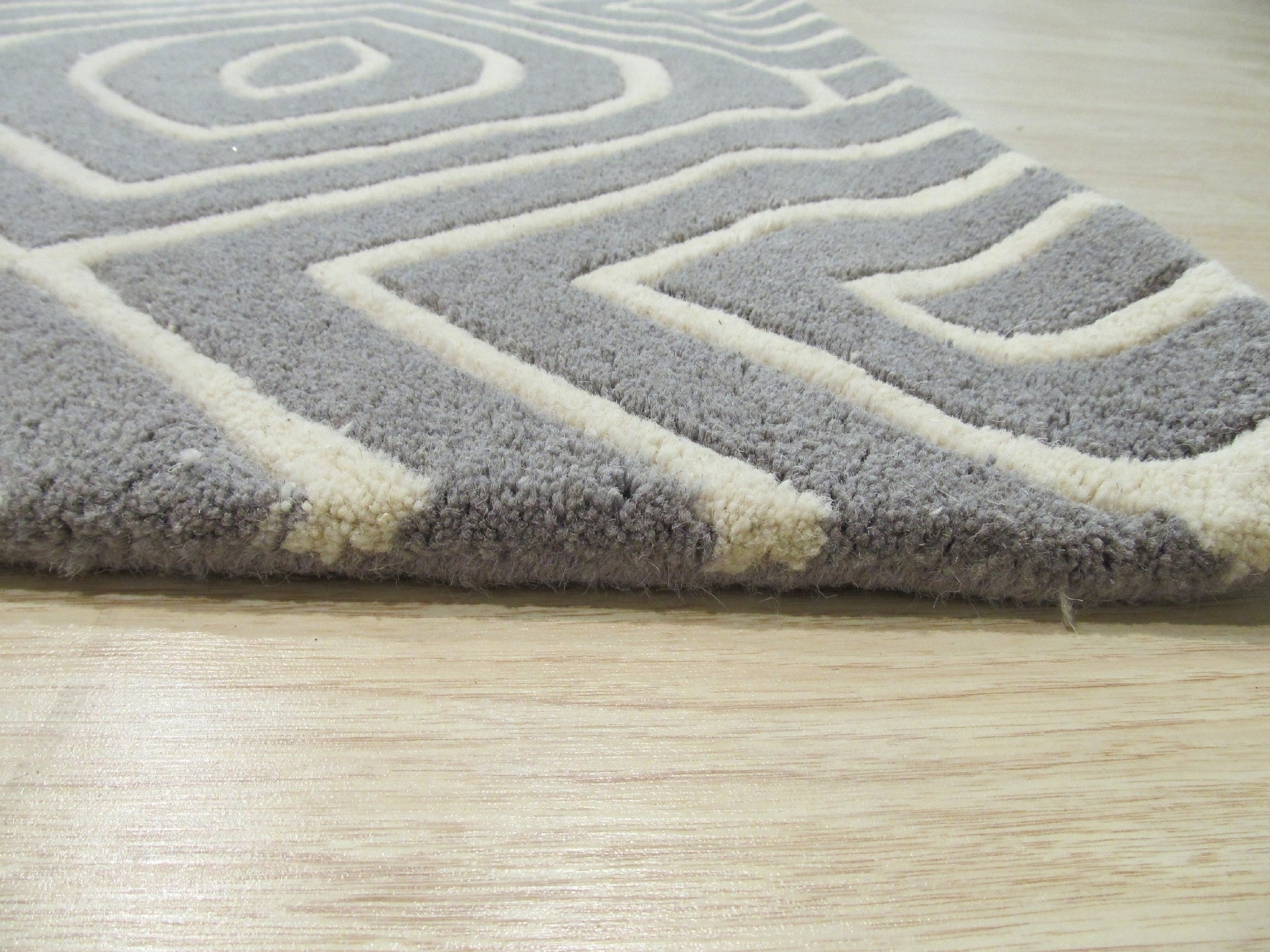 Beautiful Luna Gray Hand Tufted Wool Rug, its subtle grays and textured hand-tufted wool adding warmth and depth to a modern living space.