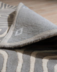 Beautiful Luna Gray Hand Tufted Wool Rug, its soft gray tones and textured hand-tufted construction complementing a modern living room with neutral furniture and natural light.