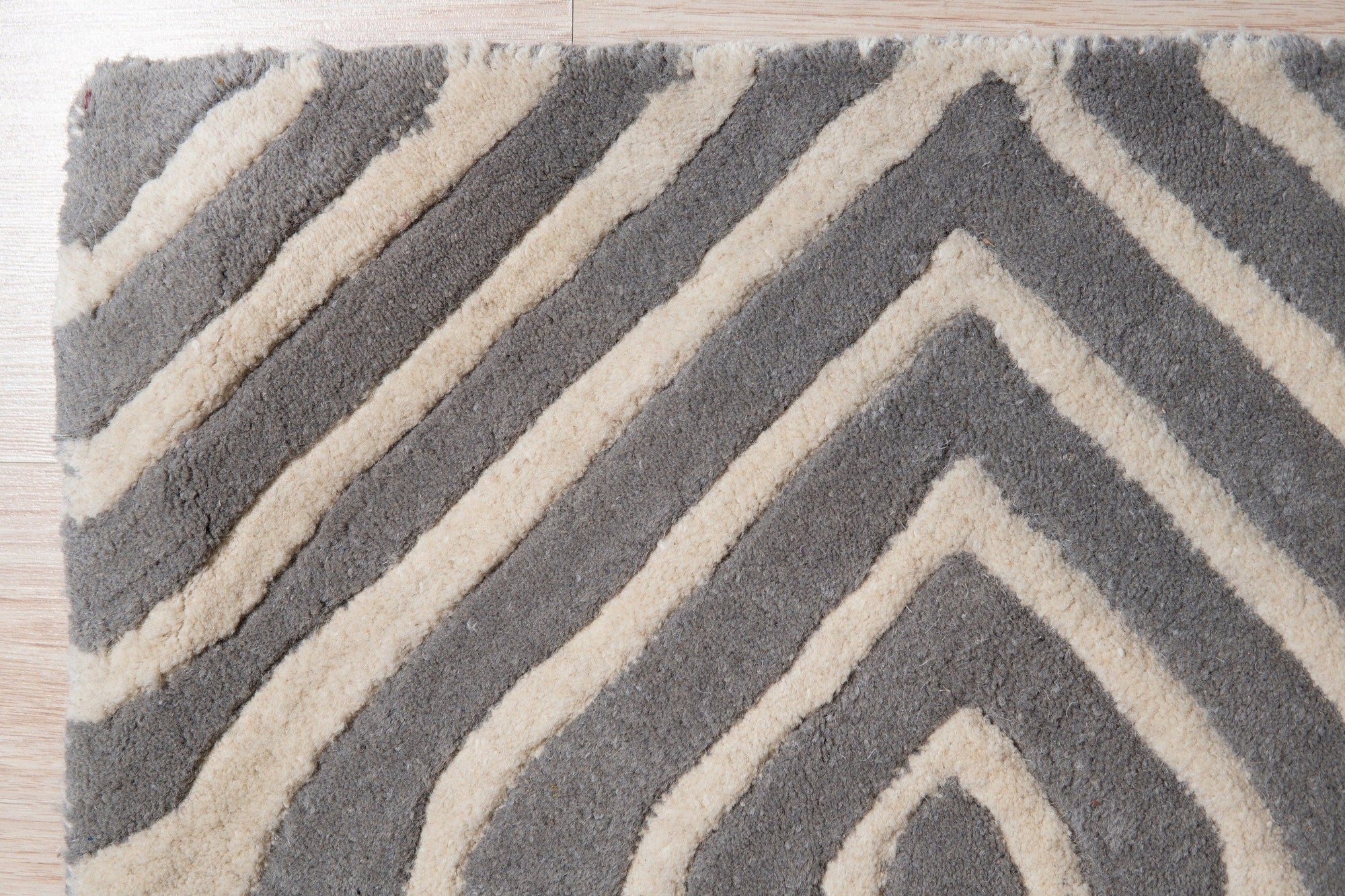 Beautiful Luna Gray Hand Tufted Wool Rug, soft gray hues and textured wool pile create a calming, neutral accent in a modern living space.