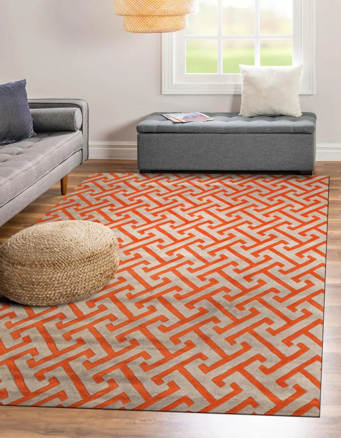 Comfortable Celia Gray Hand Tufted Wool Rug, its soft gray tones and subtle textured design subtly grounding a warmly lit living space.