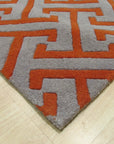 Comfortable Celia Gray Hand Tufted Wool Rug, showing its plush gray wool texture and subtle, hand-tufted design in a bright, inviting room.