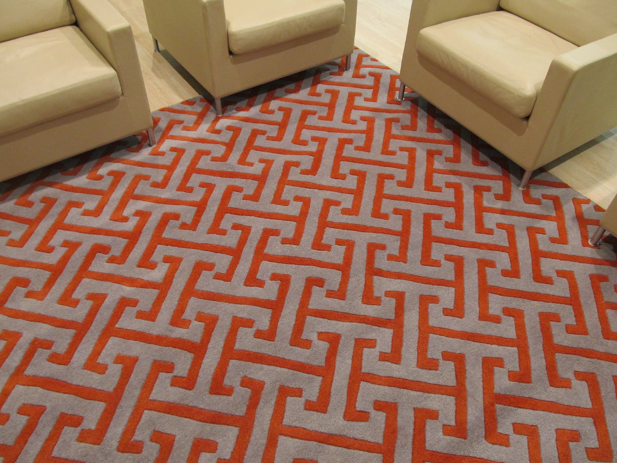Comfortable Celia Gray Hand Tufted Wool Rug, soft gray wool pile and subtle texture create a calming presence in a well-lit room with modern furnishings.