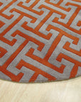 Comfortable Celia Gray Hand Tufted Wool Rug, its textured gray surface and subtle pattern complementing a light-filled, modern living room.