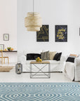 Rhea Stylish Blue Hand Tufted Wool Rug, rich blues and creams swirl in a modern abstract design, its plush wool pile inviting comfort underfoot in a stylish living space.