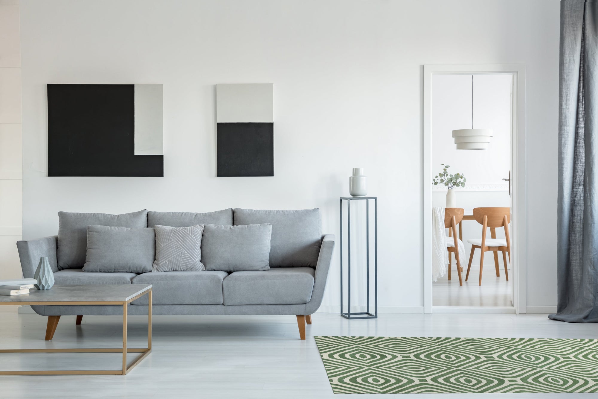 Zinnia Amara Green Hand Tufted Wool Rug, features a lush green background accented by abstract, floral-inspired designs. Hand-tufted wool construction adds depth and texture to the modern, artistic pattern.