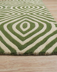 Zinnia Amara Green Hand Tufted Wool Rug, its vibrant green hues and textural weave bring life to a sunlit living room with mid-century modern furniture.