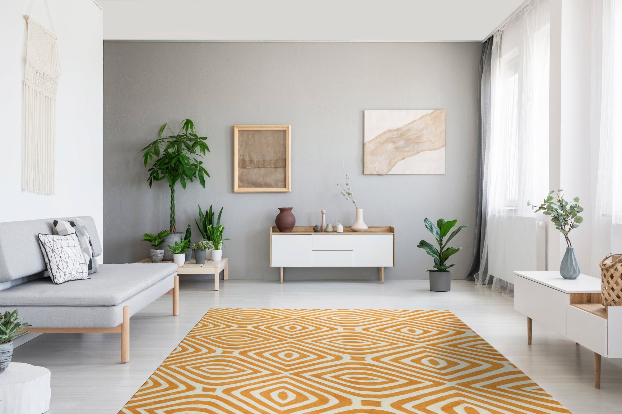 Sophisticated Jade Light Orange Hand Tufted Wool Rug, blending muted jade and light orange hues, softens a sunlit living room. The hand-tufted wool construction offers a plush texture underfoot, complementing the room's relaxed, modern aesthetic.