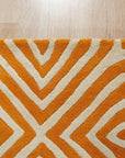 Sophisticated Jade Light Orange Hand Tufted Wool Rug, showing a blend of soft jade and light orange hues in a textured, hand-tufted construction, displayed within a room setting.