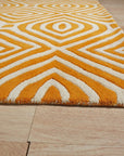 Sophisticated Jade Light Orange Hand Tufted Wool Rug displayed in a warmly lit room; hand tufted construction highlights the intricate pattern blending jade and light orange hues.