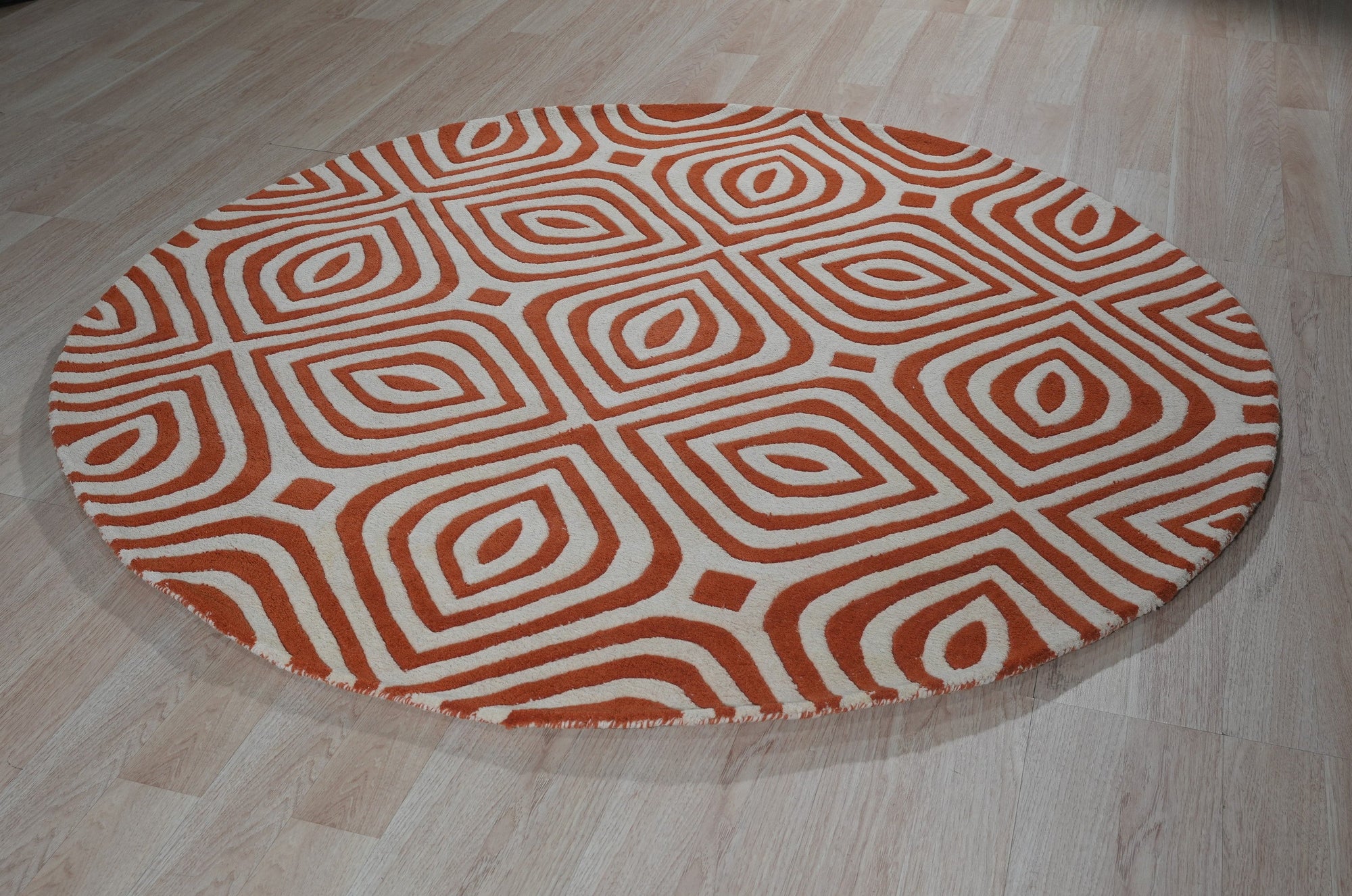 Luxurious Warm Orange Hand Tufted Wool Rug, its plush texture and vibrant orange hues lending warmth to a contemporary living space with modern furniture.