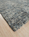Elena Modern Dark Blue Hand Tufted Wool Rug, a luxurious dark blue wool rug with a modern design, displayed in a well-lit living room setting.