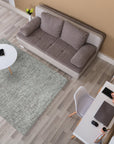 Kira Selene Dark Brown Hand Tufted Wool Rug, its rich dark brown tones and plush hand-tufted wool offering warmth and texture to a stylish living room setting.