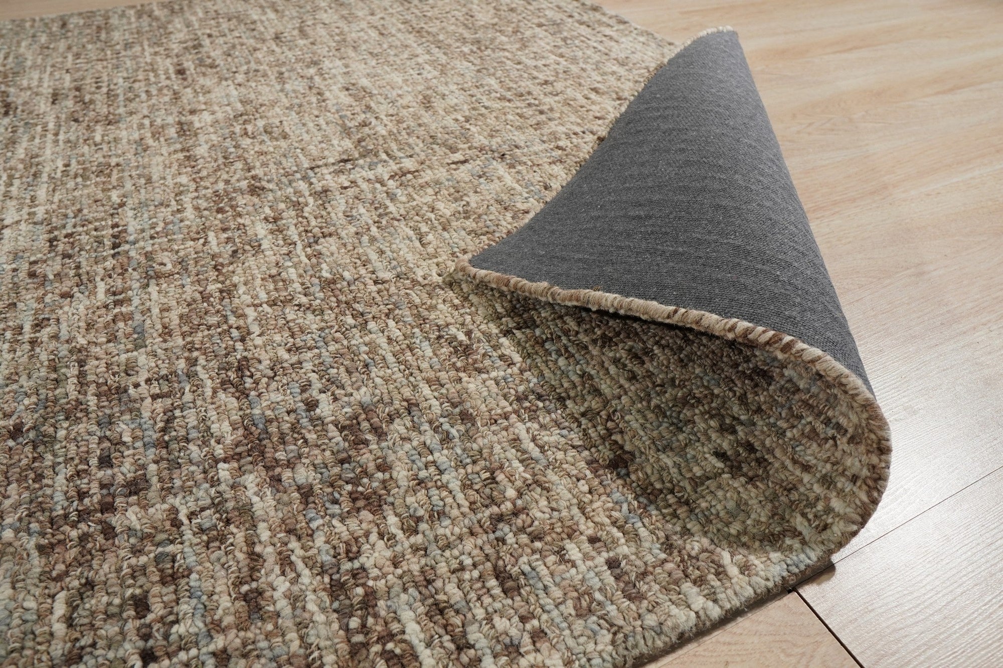Kira Selene Dark Brown Hand Tufted Wool Rug, richly textured dark brown wool underfoot, anchoring a modern living space with understated elegance.