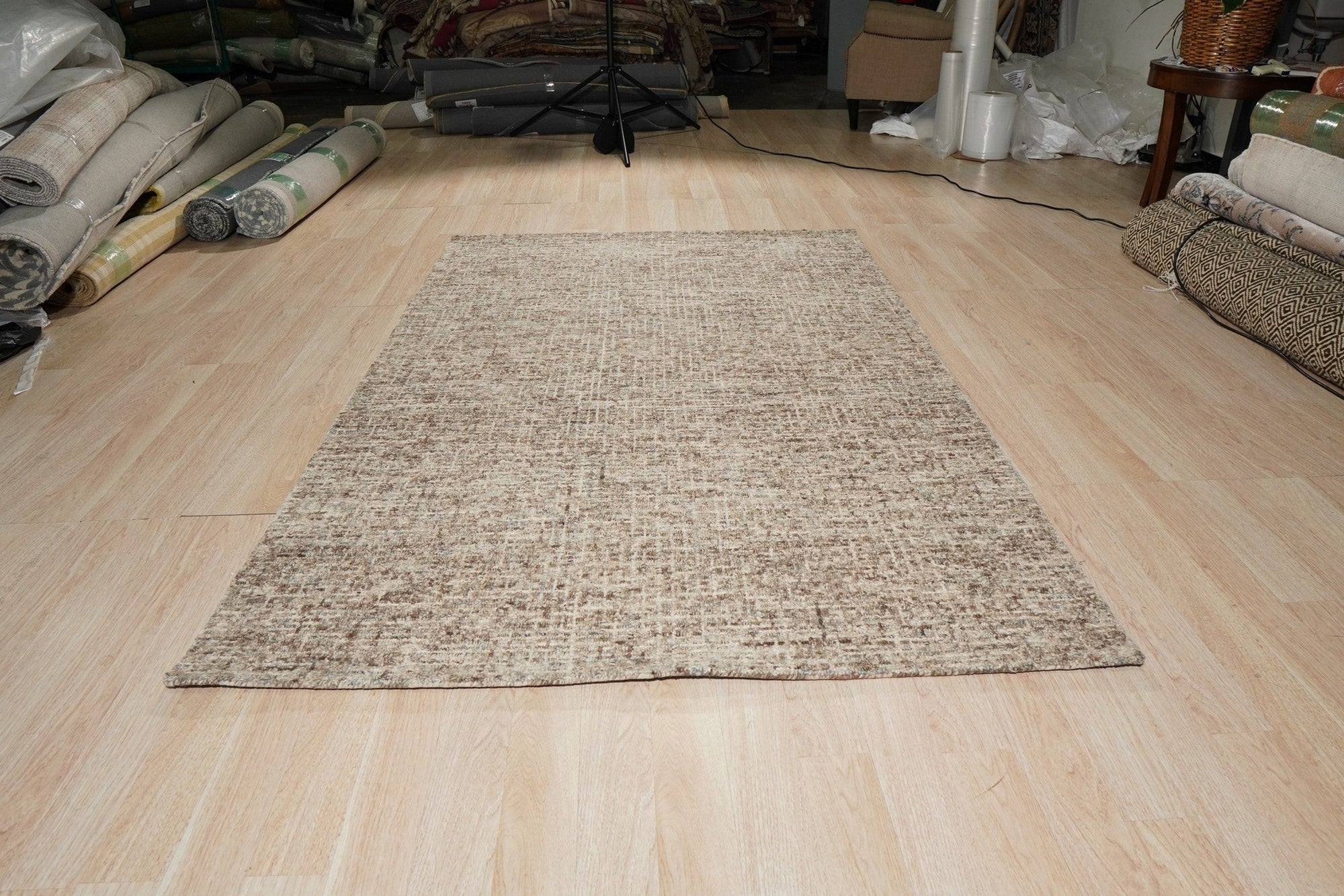 Kira Selene Dark Brown Hand Tufted Wool Rug, displaying its intricate texture and rich, dark brown hue in a styled room setting.
