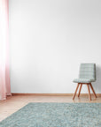 Artisan Stylish Light Green Hand Tufted Wool Rug gracing a bright, modern living room. Light washes across its soft, hand-tufted texture, highlighting subtle variations within the light green wool. Contemporary furniture complements the rug's understated elegance.