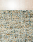 Artisan Stylish Light Green Hand Tufted Wool Rug, light green hand-tufted wool creates inviting texture under a modern, minimalist side table with a warm lamp glow softly illuminating the rug's subtle design variations.
