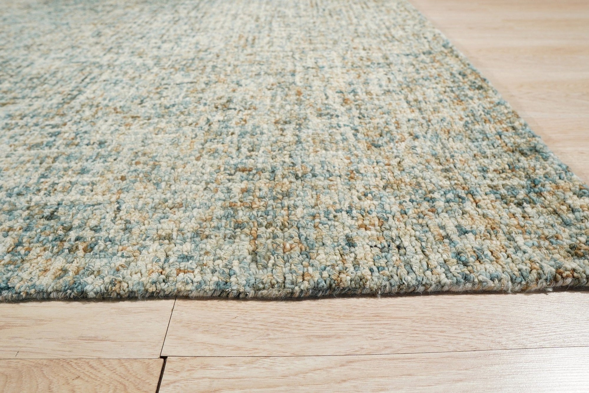 Artisan Stylish Light Green Hand Tufted Wool Rug, soft light green wool pile creating a textured, inviting surface, seen in a styled interior showcasing its subtle, modern elegance.
