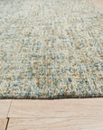 Artisan Stylish Light Green Hand Tufted Wool Rug, soft light green wool pile creating a textured, inviting surface, seen in a styled interior showcasing its subtle, modern elegance.