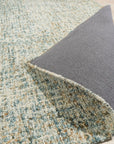 Artisan Stylish Light Green Hand Tufted Wool Rug, a light green wool rug featuring a subtly textured hand-tufted design, seen in a bright room setting.