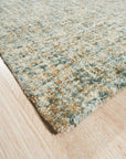 Artisan Stylish Light Green Hand Tufted Wool Rug, a calming light green hand-tufted wool rug, softens a modern living room with its plush texture and subtle design, complemented by warm lighting and neutral furniture.