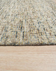 Maya Bianca Navy Hand Tufted Wool Rug displayed on a hardwood floor, showcasing its intricate hand-tufted design and rich navy tones.
