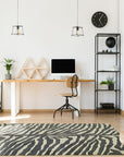Penelope Stylish Gray Hand Tufted Wool Rug, showcasing subtle variations in gray tones and plush texture in a room setting, suggesting warmth and sophistication.