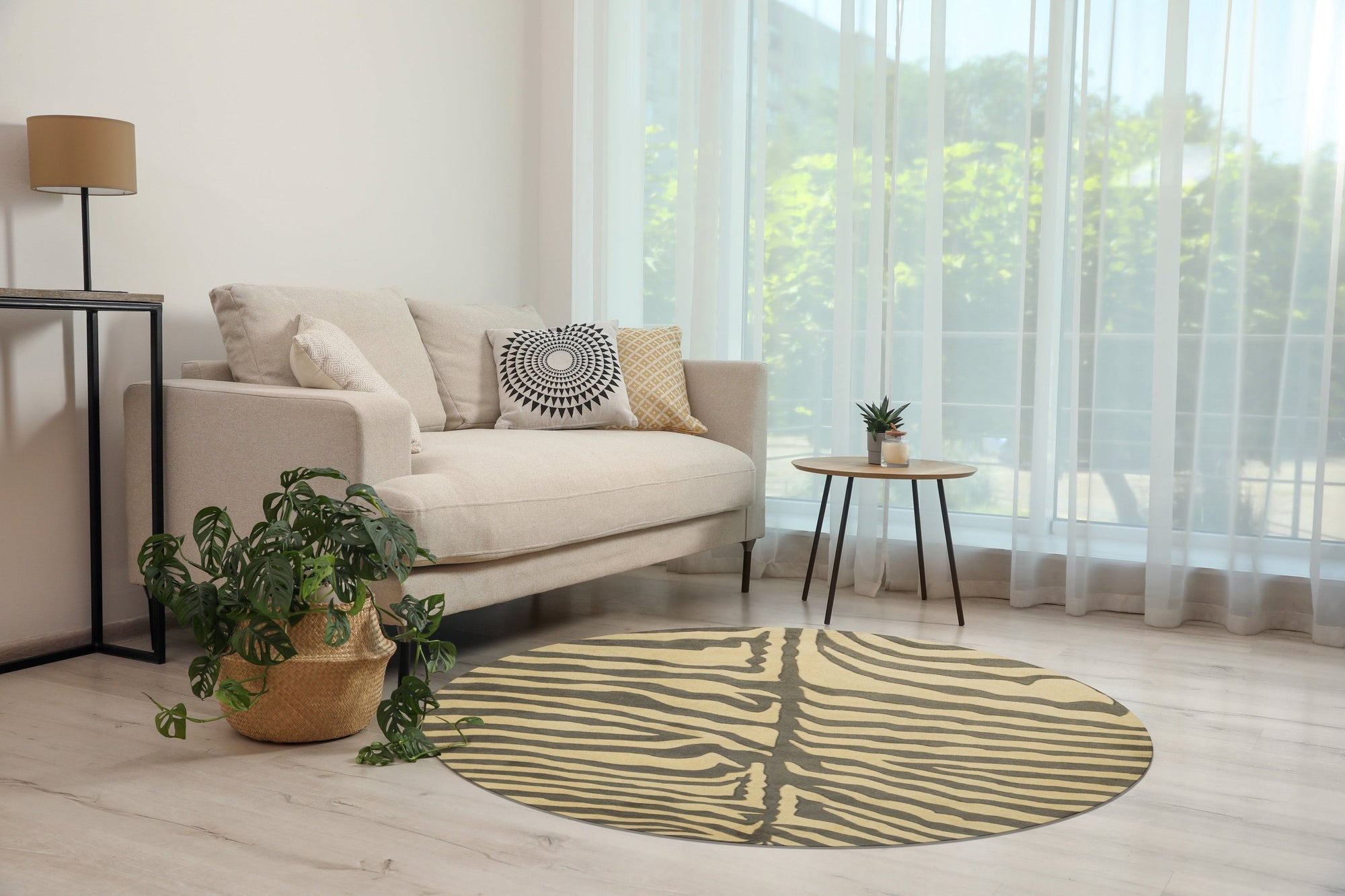 Sleek Graceful Multicolor Hand Tufted Wool Rug displayed on a light wood floor. The rug features a blend of grey, blue, and beige tones in an abstract, flowing pattern, highlighting its hand-tufted wool construction and modern aesthetic.