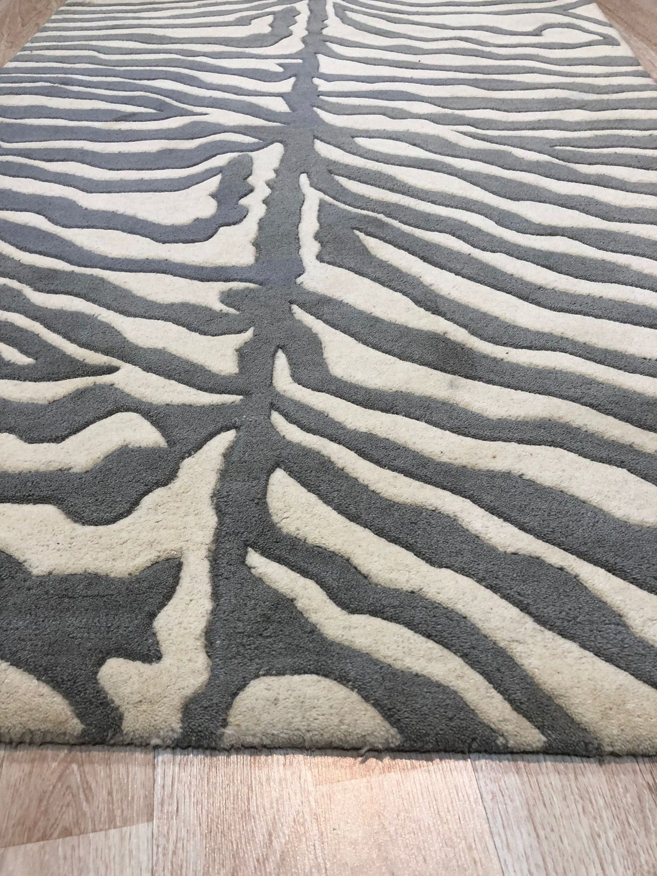 Penelope Stylish Gray Hand Tufted Wool Rug, its subtle, textured gray tones anchoring a living space with contemporary elegance.