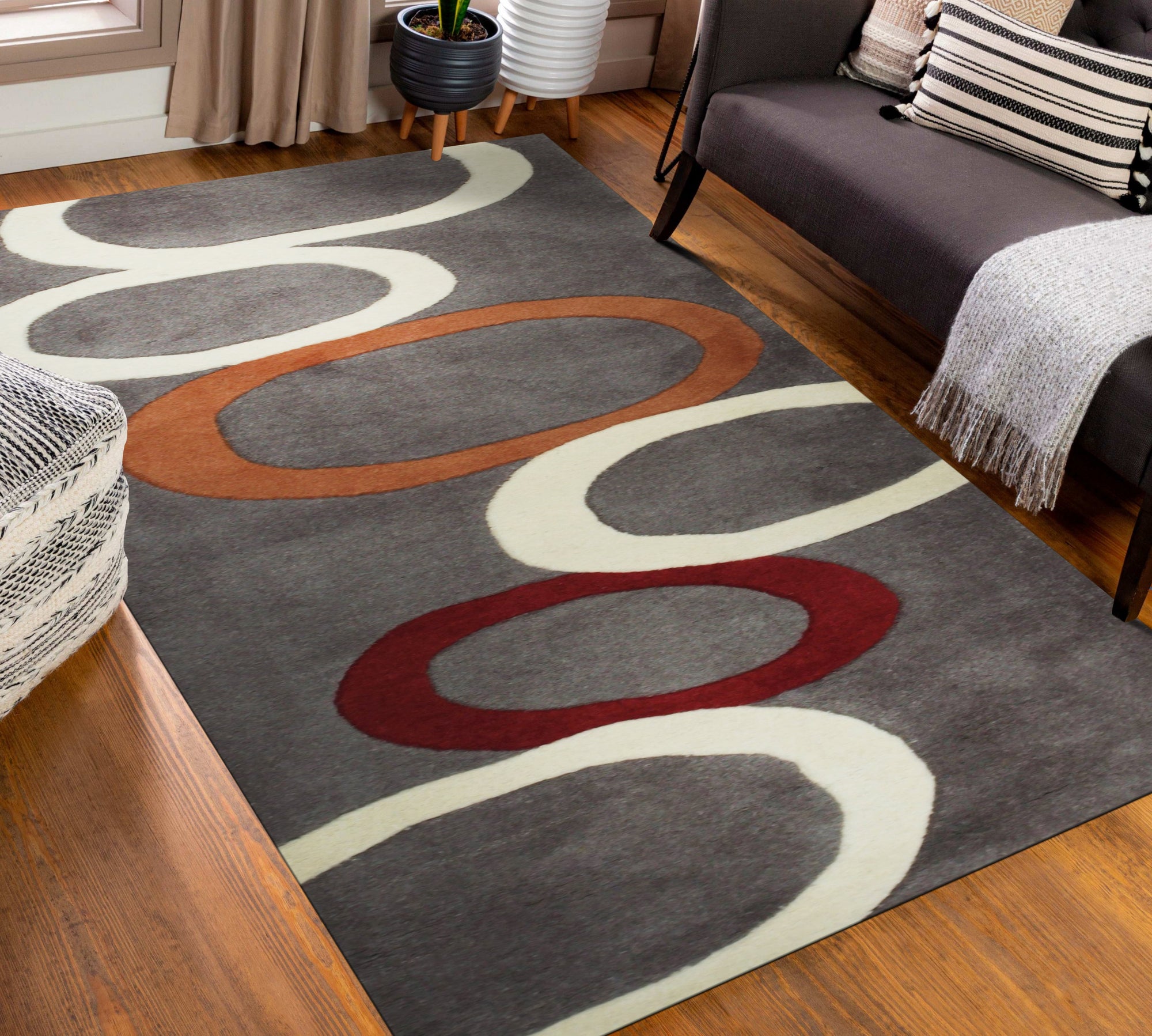 Celia Clara Gray Hand Tufted Wool Rug displayed in a living room setting, grounding a seating area with soft grays and subtle patterns.