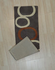 Celia Clara Gray Hand Tufted Wool Rug graces a light-filled living room, its soft gray tones complementing neutral furniture and adding subtle texture to the space.