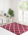 Timeless Louie Burgundy Hand Tufted Wool Rug, a richly patterned burgundy wool rug with intricate floral and geometric motifs, displayed in a softly lit living room setting.