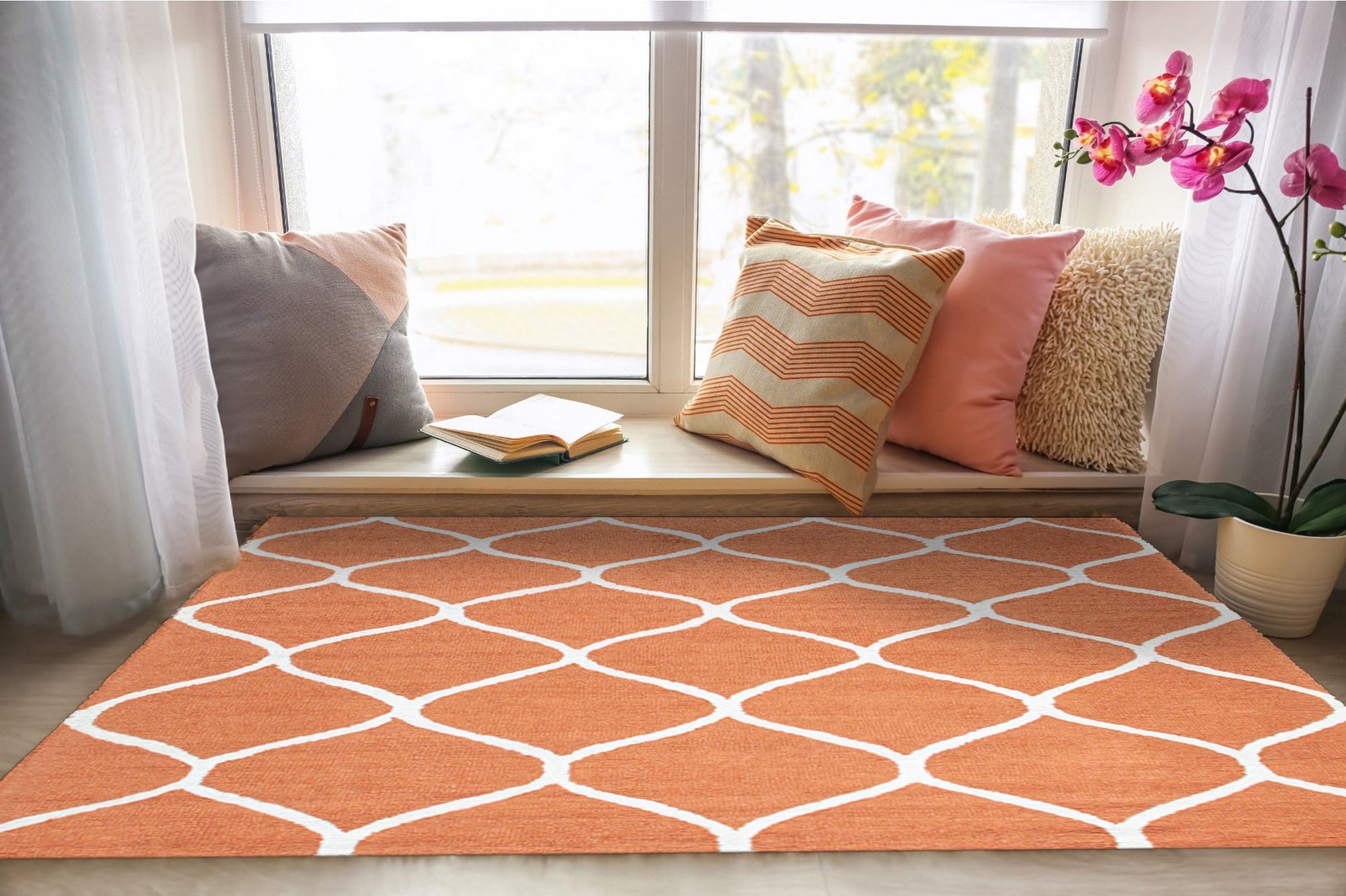 Maya Rustic Orange Hand Tufted Wool Rug, showcasing warm, rustic tones and a textured hand-tufted wool construction, subtly grounded in a neutral-toned living space.
