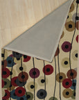 Modern Isla Multicolor Hand Tufted Wool Rug displayed in a living room setting, its vibrant hues and textured hand-tufted wool adding warmth to the space.