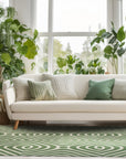 Radiant Amara Green Hand Tufted Wool Rug, showcasing a vibrant green hue and plush texture, lying elegantly on a light wooden floor, adding warmth and color to the room.