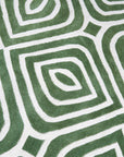 Radiant Amara Green Hand Tufted Wool Rug, showcasing its lush, deep green hue and textured wool pile in a modern living room setting.