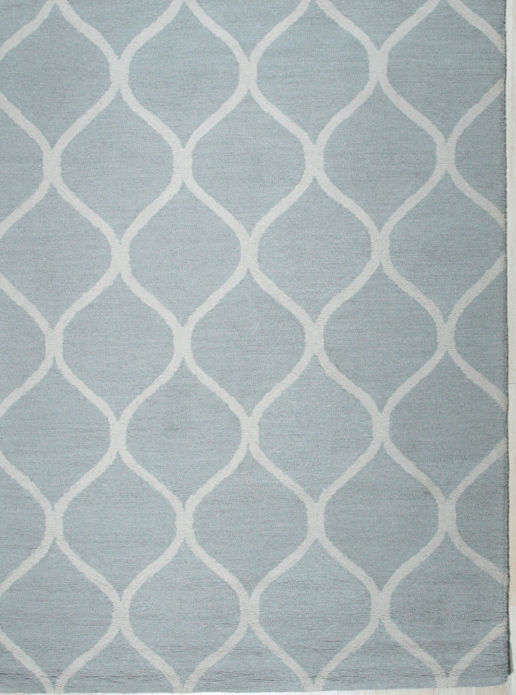 Isolated view of Handcrafted Laine Light Green Hand Tufted Wool Rug, showcasing its subtle textured design and soft, verdant hue.