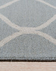 Handcrafted Laine Light Green Hand Tufted Wool Rug, soft light green texture and subtle pattern radiating warmth and comfort within a bright, airy living space.